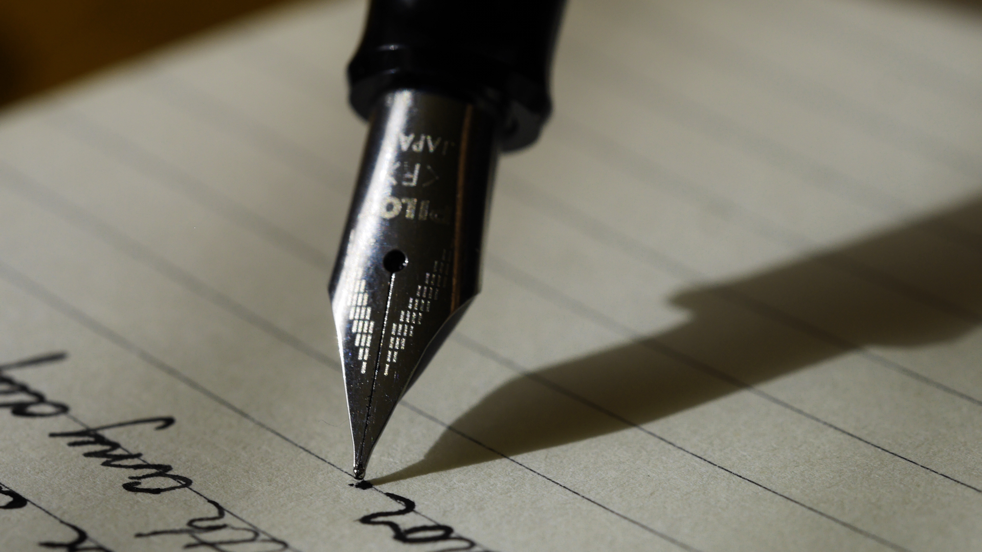 Pen writing on lined paper